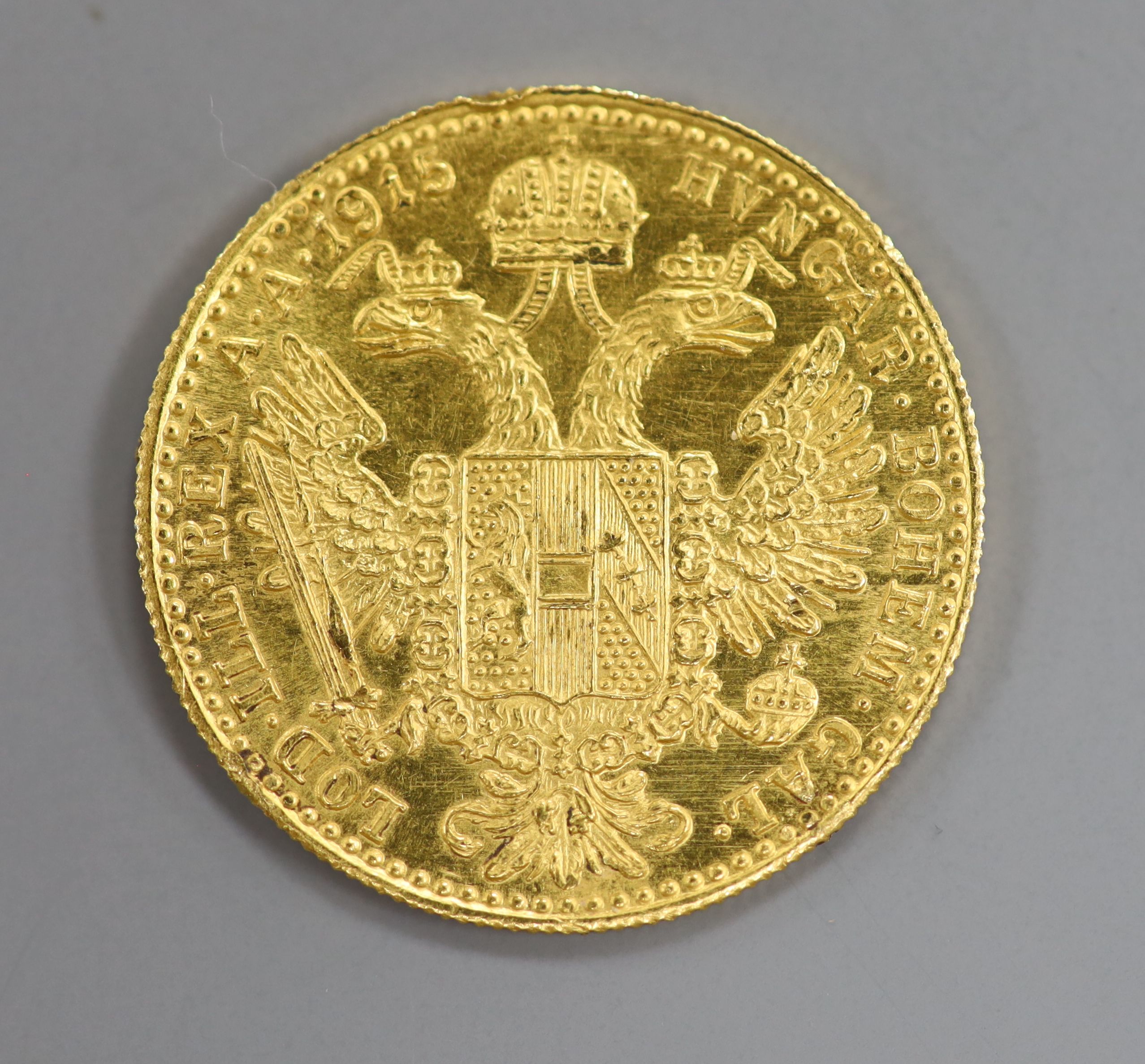 A 1915 gold one ducats coin.